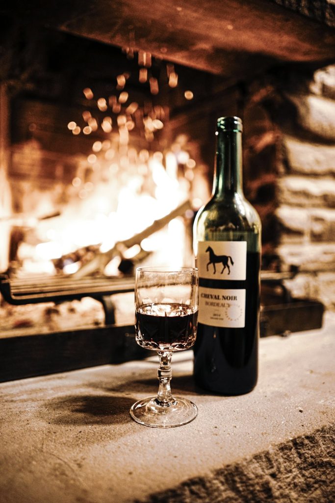 a-bottle-of-wine-and-a-glass-on-a-table-h3vas-h2p1g